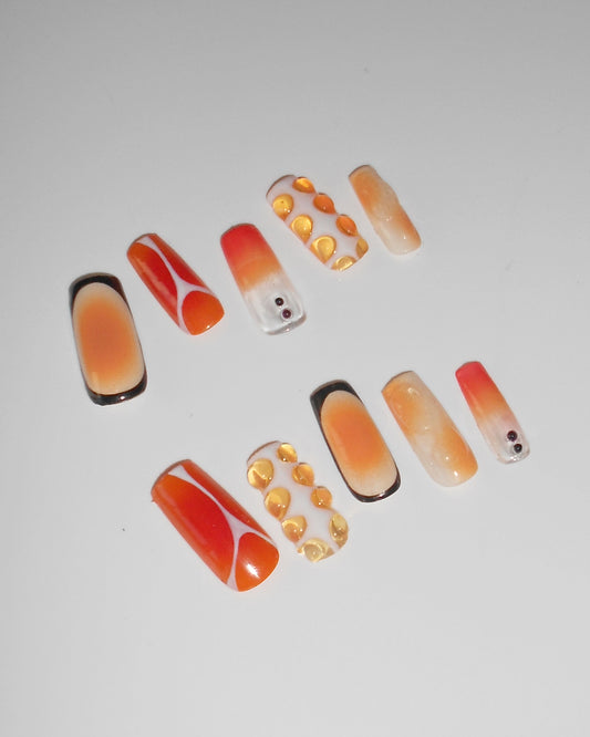 Orange J nails