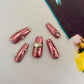 Pink Chrome Heart Nails